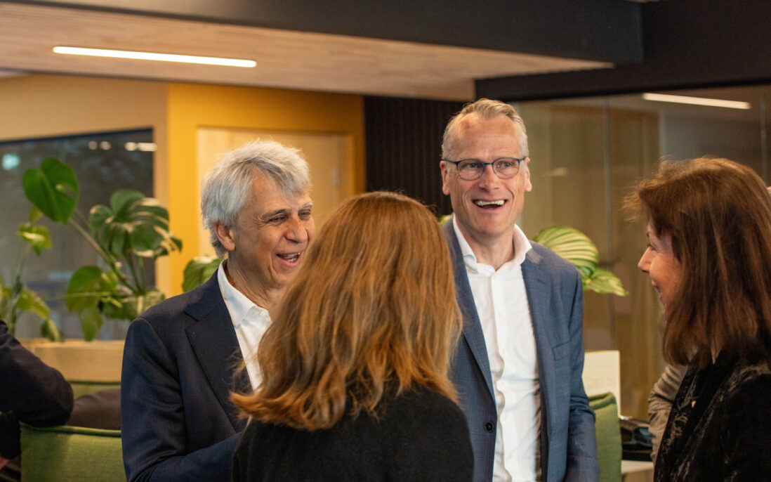 4 happy people mingling.